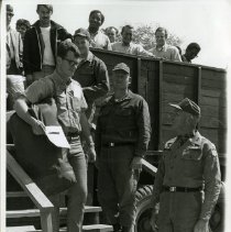 Reserve reinforcement processing: recruits getting out of a truck