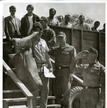 Reserve reinforcement processing: recruits getting out of a truck