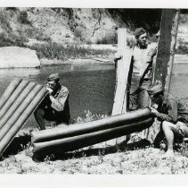 Soldiers building floating bridge