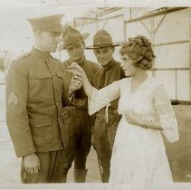 Mary Pickford giving locket to soldier