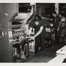 Technicians using various machines to create language textbooks, 1971.