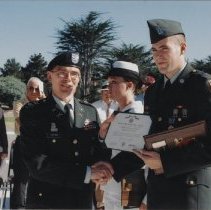 Col. Michael Simone presents award at Soldier Field, n.d.