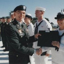 Col. Michael Simone presents award at Soldier Field, n.d.