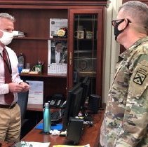 Chief of Staff Steve Collins Receives Coin Award from Lt. Gen. James Rainey
