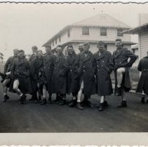 Soldiers Pose for Photgraph While Wearing Only Overcoats and Boots