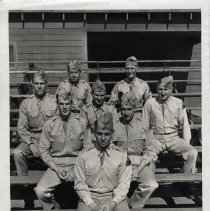 Army Personnel Pose for Group Photo on Bleachers