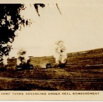 Army tanks advancing under real bombardment