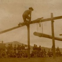 Sepia colored image of soldier climbing during a training exercise