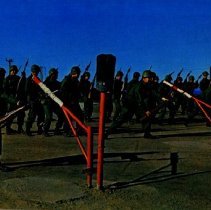 Colored image of soldiers in combat training with bayonets