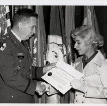Commandant Col. Kibbey Horne presenting a civilian award