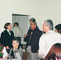 Ben De La Selva's talking to Command Sergeant Major Jackie V. Moore and other attendees of his retirement party at the Defense Language Institute Foreign Language Center (DLIFLC)