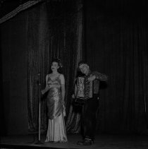 Salinas Army Air Base (SAAB), United Service Organization (USO) show, woman and man on stage with an accordion, n.d.