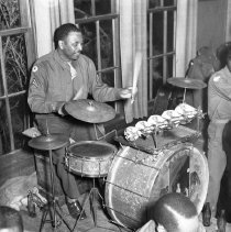 Corporal Plays the Drums at First Medical Regiment Party, 1943