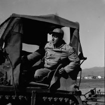 Sergeant Operates Tractor for Baseball Diamond Construction, 1943