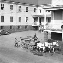 Man Rides Horse-Drawn Cart Past Unit Area, 1942-1944
