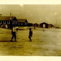 Soldiers Play in Field at World War II Training Camp