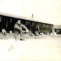 Spectators Watch Soldier Play Game