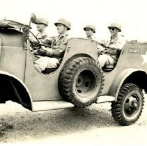 Soldiers and General Stilwell in Jeep at Fort Ord