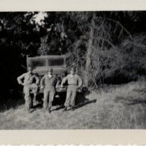 Soldiers Pose in Front of their Jeep in a Wooded Area