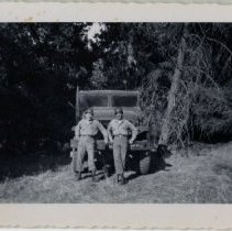 Soldiers Pose in Front of their Jeep in a Wooded Area