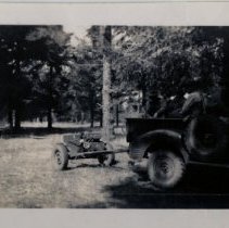 Soldiers in Jeep Tow Anti-Tank Gun through Woods at Fort Lewis