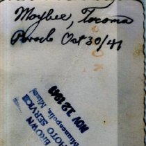 Unknown Private Stands Between Vehicles at Fort Lewis