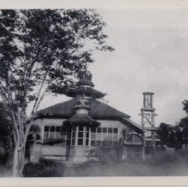 Exterior View of Dilapidated Building and Bell Tower