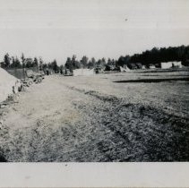 Army Vehicles Parked on Field at WWII Training Camp