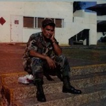Portrait of SSG Begay Resting on Steps while Stationed in Panama