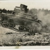 Light Tank Flies By during Field Manuever at Camp Ord