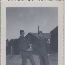 Two Soldiers Take Photo Together on a Military Base