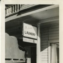 Young Boy Poses Next to Army Truck at a Laundromat in Pacific Grove