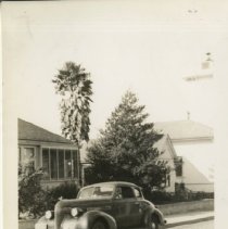 Young Boy Poses Next to Army Truck at a Laundromat in Pacific Grove