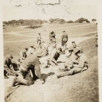 Soldiers Participate in a Training Exercise in a Field at Fort Ord