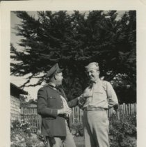 Captain Buyak and Lieutenant Beck Talk at a Carmel Home