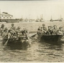 Soldiers Paddle a Boat Around a Harbor in Monterey for Training