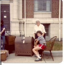 Elenora West  with unknown helper roasting peanuts