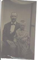 unidentified man and boy