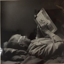 A.C. Gentry Working a Crossword Puzzle