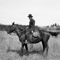 Actor in costume posing on horse