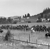 Film crew with actors and troops on field set
