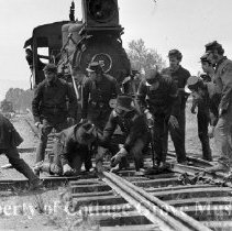 Actors in soldier costumes resetting the track switch.