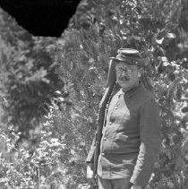 Actor in costume posing with gun