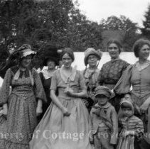 Group portrait of women and children extras