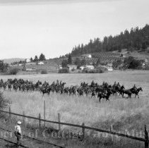 Troops and film crew on field set
