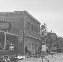 Actors and crew on town set between scenes.