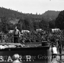 Buster Keaton standing on The Texas with troops in background