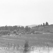 Troops and film crew on field set