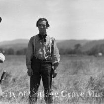 Buster Keaton and actor posing in field