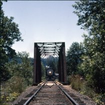 Blue Goose approaching railroad bridge
